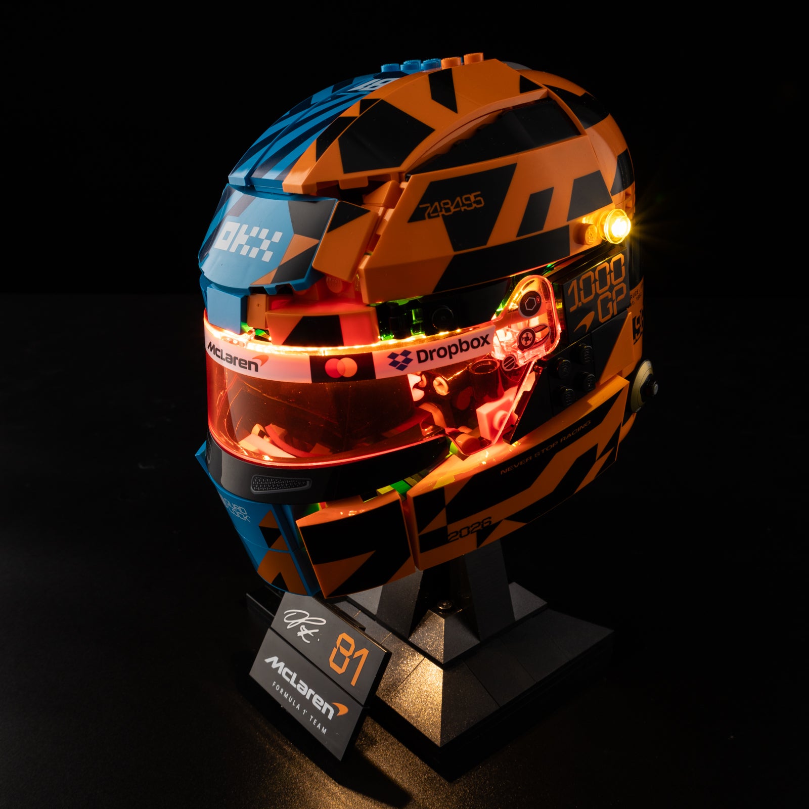 Oscar Piastri Helmet 43017 - lit with full glow, hero view